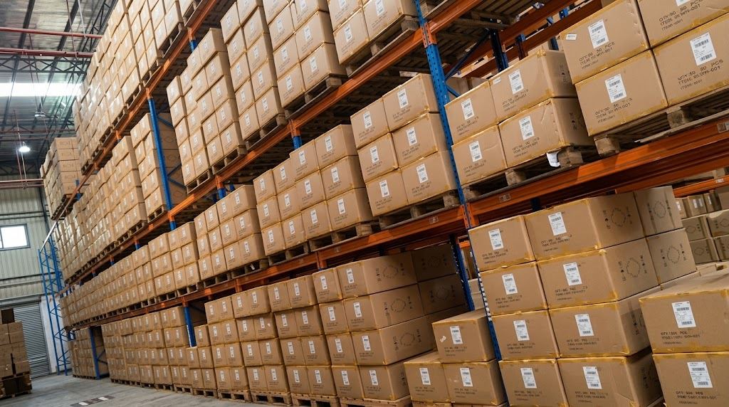 Cartons of shoes stored on pallet racks